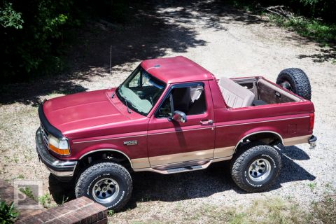 1995 Ford Bronco - This 1995 Ford Bronco is shown from a 3/4 front angle on a gravel surface.