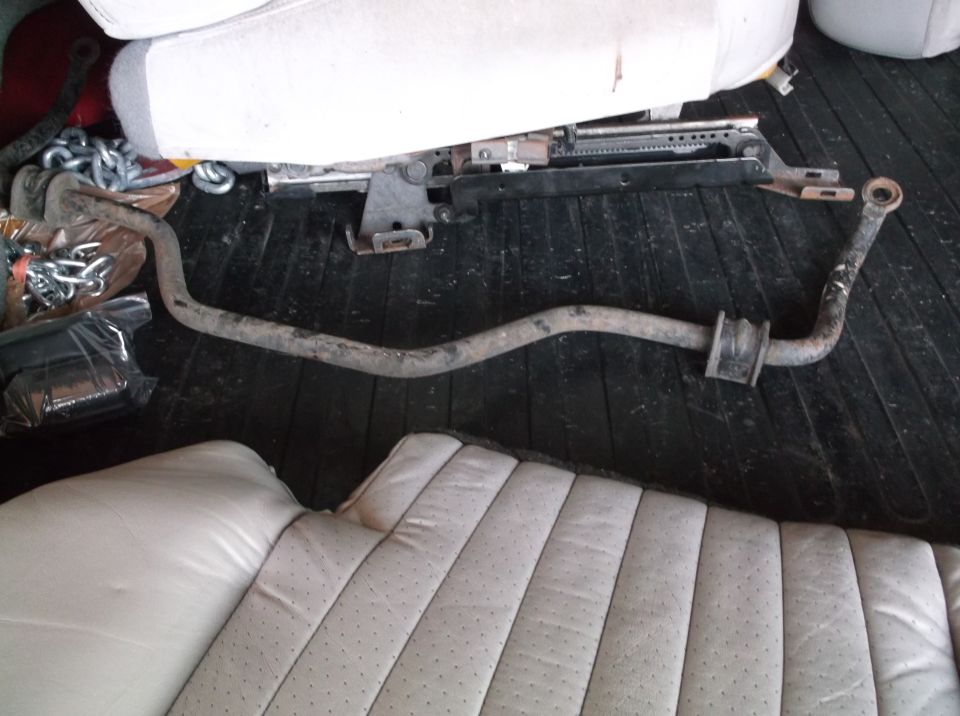 car part and seats on a dark floor