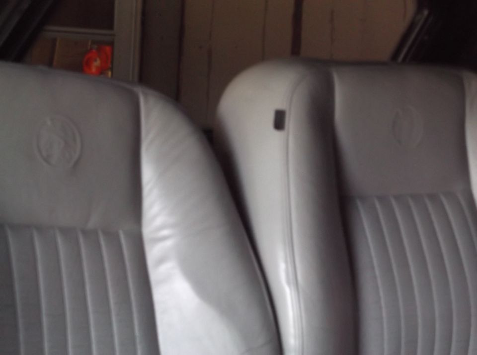 Gray leather interior seats with embossed emblems