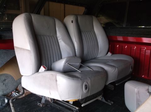 1999 Mercury Grand Marquis - Interior view of gray leather car seats, possibly removed from a vehicle.