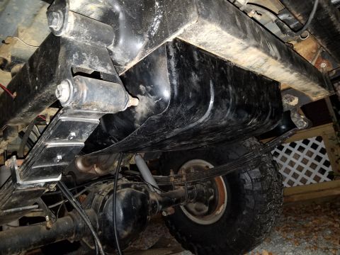 1988 Ford Bronco - Undercarriage detail with fuel tank and suspension components visible. Supermotors.net logo present.