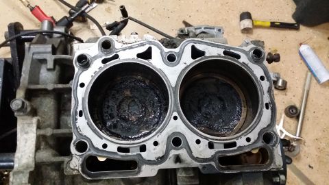 2007 Subaru Impreza - Engine block with two cylinders showing significant carbon buildup, alongside a SuperMotors.net logo.