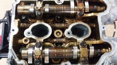 2007 Subaru Impreza - Close-up of an engine's cylinder head, revealing internal components like camshafts and valves.
