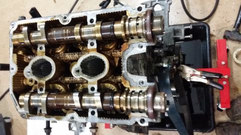 2007 Subaru Impreza - Close-up of an engine's cylinder head, showing internal components like camshafts and timing chain.