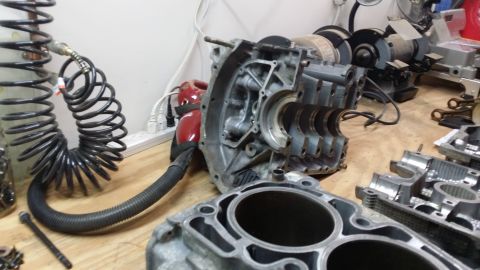 2007 Subaru Impreza - Disassembled engine components are laid out on a workbench, ready for repair or rebuilding.