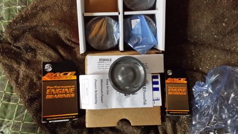 2007 Subaru Impreza - Engine parts including a Mahle piston and ACL Race engine bearings are laid out.