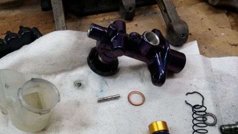 2007 Subaru Impreza - Brake master cylinder assembly parts laid out on a cloth for service.