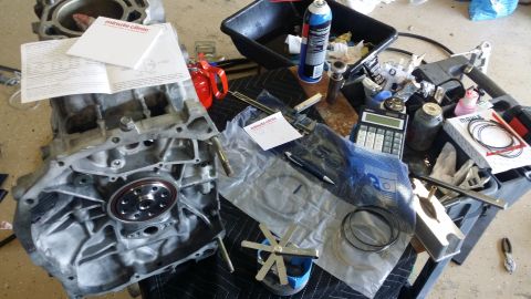 2007 Subaru Impreza - Engine parts and tools are laid out on a table, suggesting a repair or rebuild in progress.