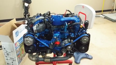 2007 Subaru Impreza - Blue Subaru EJ25 engine assembly on a stand, possibly for a 2007 Impreza build.