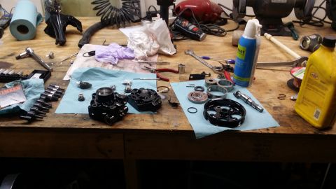 2007 Subaru Impreza - Disassembled automotive parts are spread across a workbench, ready for repair or replacement.