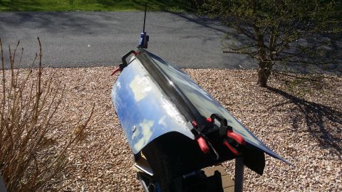 2007 Subaru Impreza - A car door is being worked on outdoors, clamped in place.