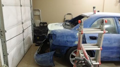 2007 Subaru Impreza - Subaru Impreza in garage, being prepped for paint with bodywork underway.