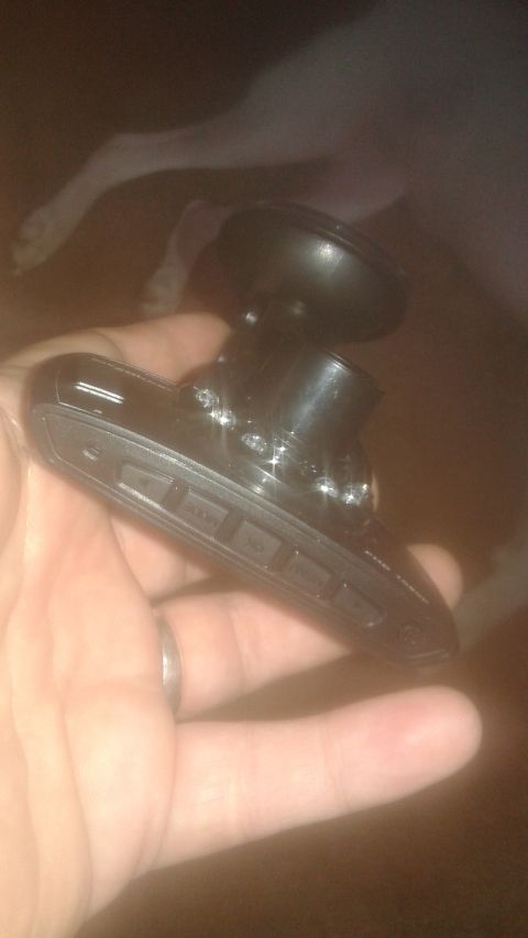 1996 Ford Bronco - Dash cam being held in hand, ready for installation.