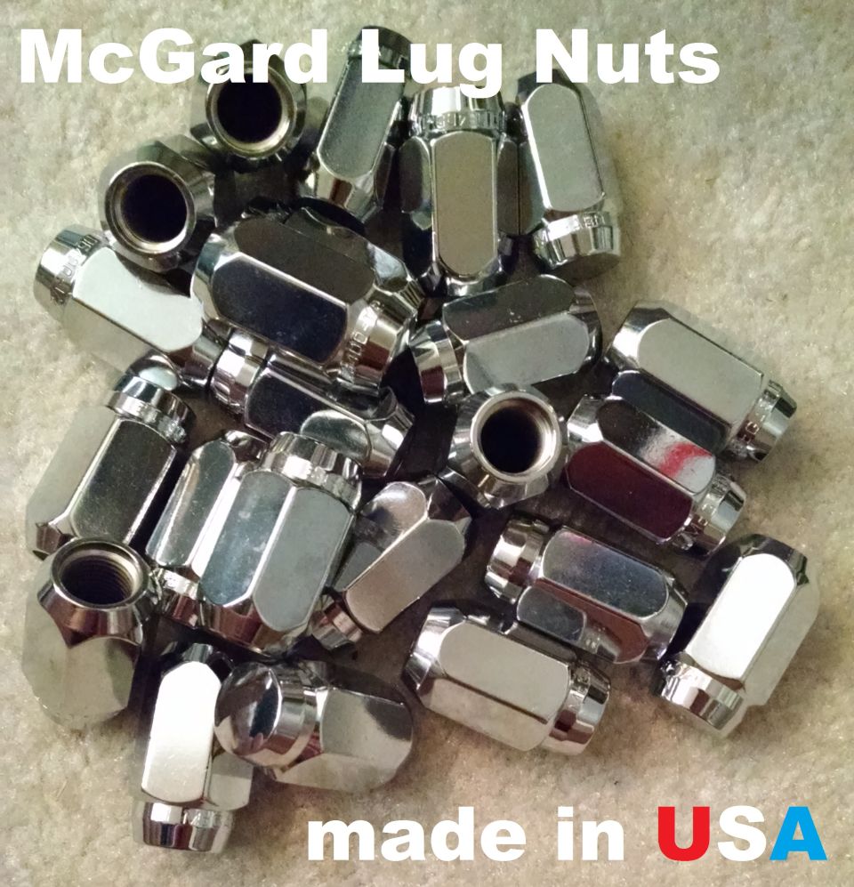 Pile of chrome McGard conical seat lug nuts on carpet with made in USA text overlay