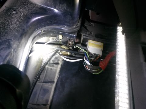 1996 Ford Bronco - Close-up view of a vehicle's interior wiring harness and electrical connectors, likely related to HVAC or dashboard components.