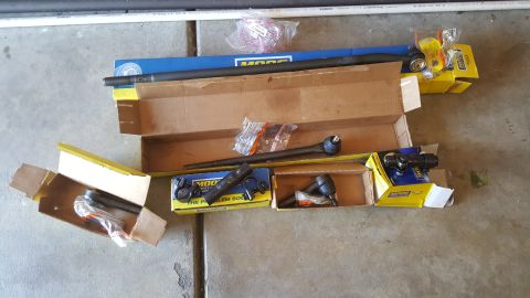 1996 Ford Bronco - Various new MOOG steering components are unpacked and ready for installation.