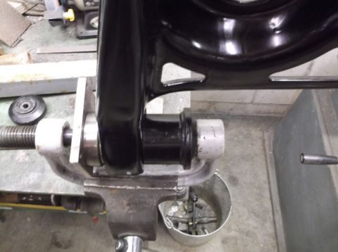 2001 Mercury Grand Marquis - Automotive suspension part being worked on in a vise.