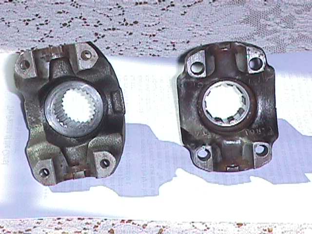Two driveshaft yokes with splined openings