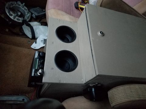 1988 Ford Bronco - Custom center console with cup holders and CB radio installed in a vehicle interior.