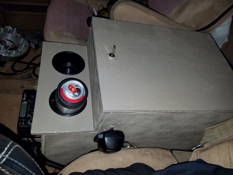 1988 Ford Bronco - Interior view of a custom center console with a locked compartment and cup holders.