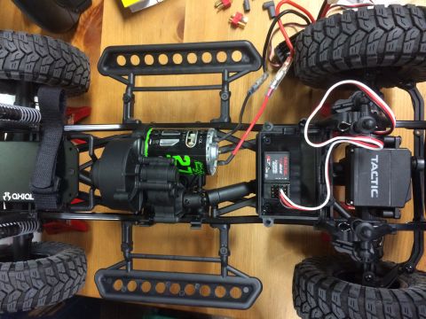 1989 Ford Bronco - Top-down view of an RC car chassis, showing its motor, gearbox, and electronic components.