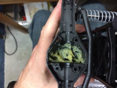 1989 Ford Bronco - Close-up of a greased differential housing from an RC car, showing internal gears.