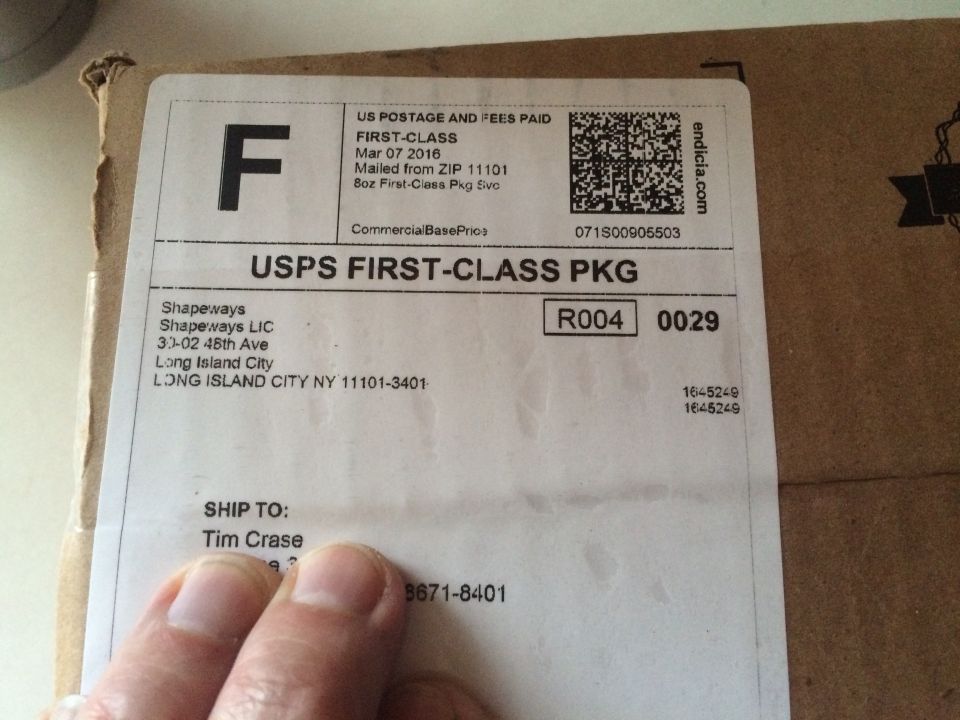 Shipping label on a cardboard box.