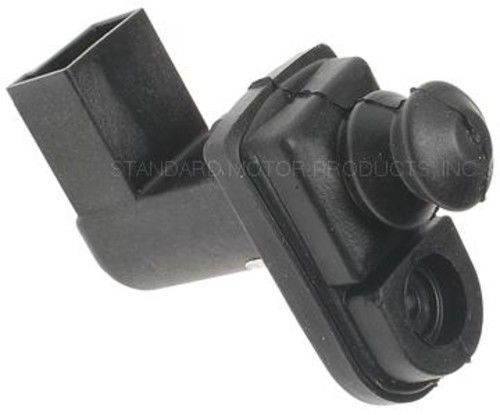 Black plastic door jamb switch with rubber boot
