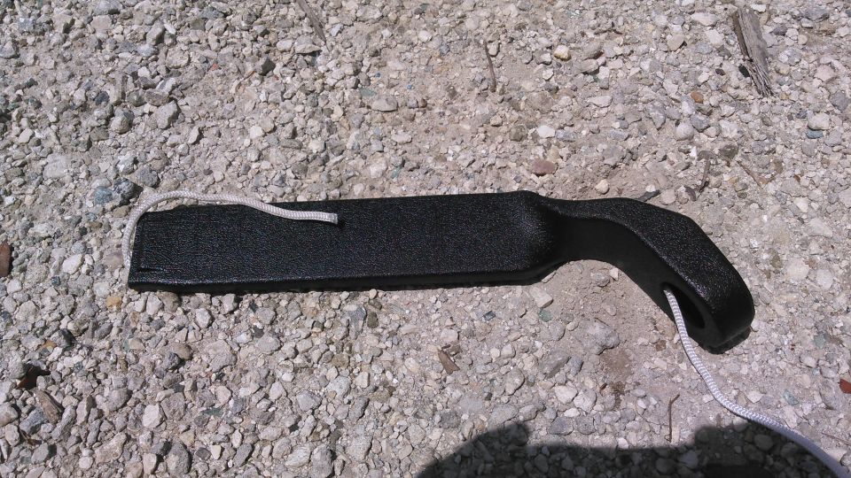 feed a durable rope through the sleeve so we can pull the belt through. even after grindingt he corners of the metal tab, it still takes a good amount of force to pull through