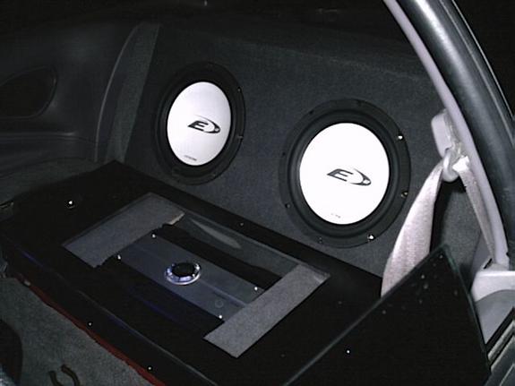 Car interior with dual Alpine subwoofers and amplifier