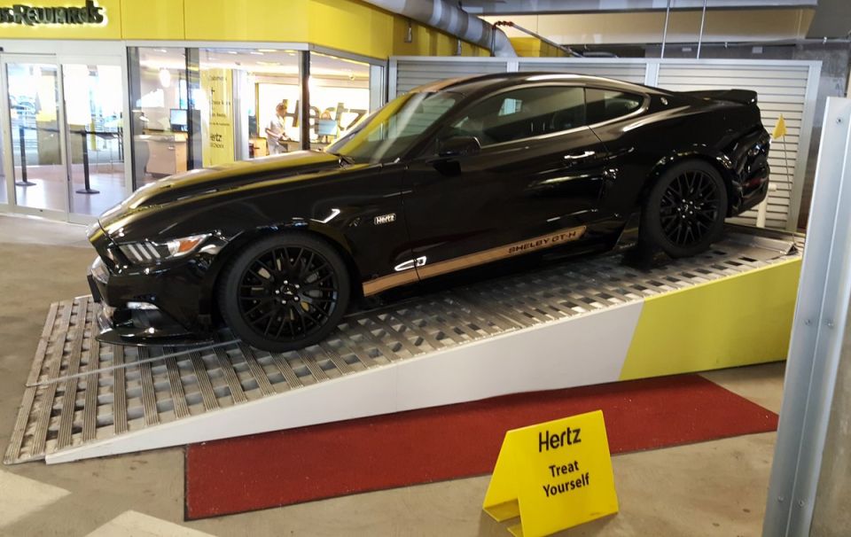 Black Shelby GT-H Mustang on display ramp at Hertz