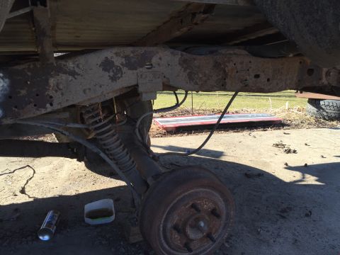 1996 Ford F-150 - Close-up view of the undercarriage of a truck, highlighting its mechanical components.