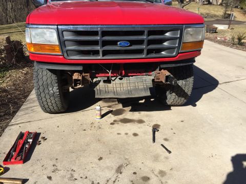 1996 Ford F-150 - Front view of a red 1996 Ford F-150 pickup truck, showing the grille and headlights.