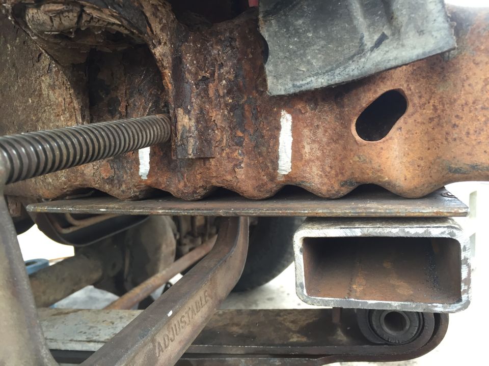 I think it was 3x5 angle.  Set in against the crumple zone, clamped in, ready to drill the holes all the way through frame and angle, to bolt them on.