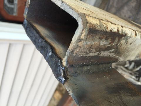 1996 Ford F-150 - Close-up view of a welded metal frame section, showing weld details and material texture.