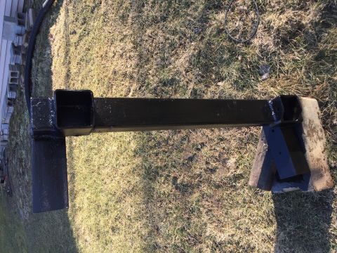 1996 Ford F-150 - A black trailer hitch receiver is shown mounted on wooden blocks outdoors.