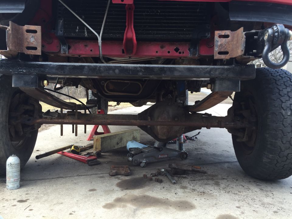 another view of the crossmember and springs under the truck.  Notice no rear shackle mounts yet.  truck supported by jackstands.