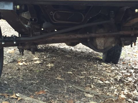 1996 Ford F-150 - more flex, plus view of chopped engine crossmember for axle clearance.
