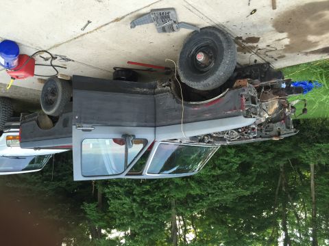 1967 Ford Custom Wagon - This vehicle appears to be undergoing repairs or disassembly, with its front fender removed and engine components exposed.