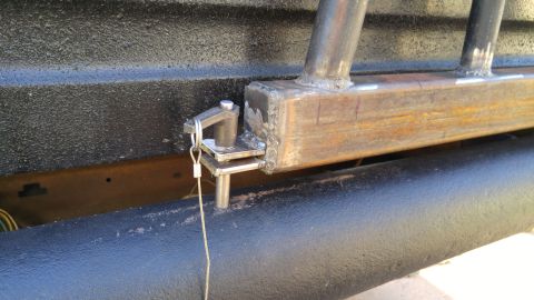 1978 Ford Bronco - Close-up of a custom metal bumper assembly, showing a pin latch and welded components.