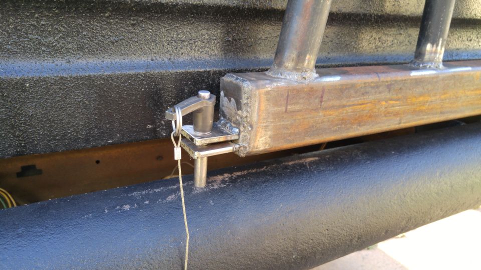 Custom metal bumper with a pin latch mechanism and welded brackets