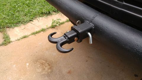 1978 Ford Bronco - Close-up of a black tow hitch with double hooks mounted on a vehicle's bumper.