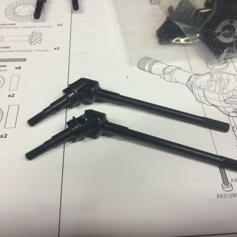 1989 Ford Bronco - RC car drive shafts and instruction manual pages are visible in the photo.
