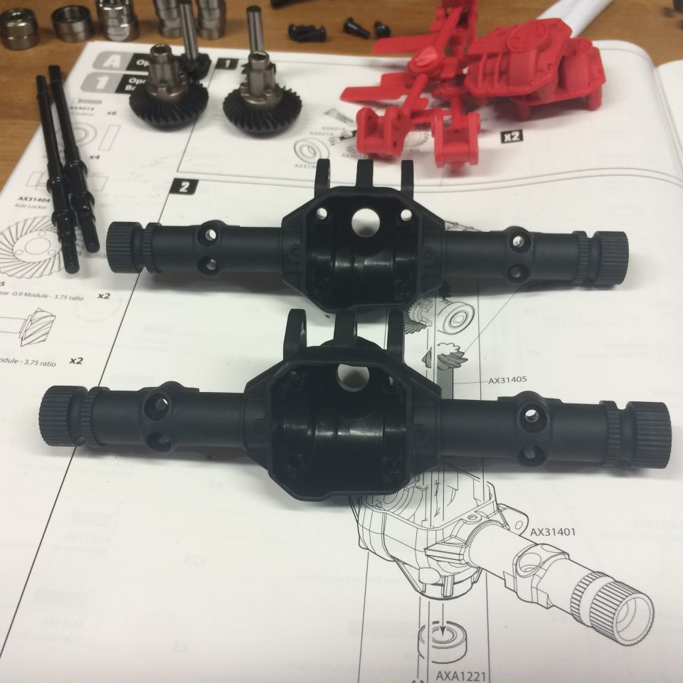RC car axle parts and instruction manual with diagrams and text