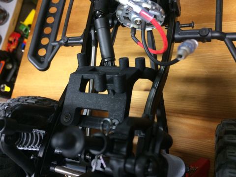 1989 Ford Bronco - The intricate internal structure of a remote-controlled vehicle is visible in this close-up shot.
