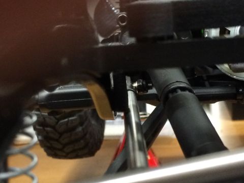 1989 Ford Bronco - Close-up view of a remote control car's chassis, showing suspension and drivetrain components.