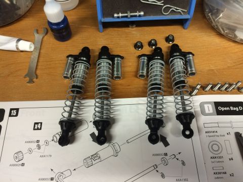 1989 Ford Bronco - Assembly instructions and parts for RC car shock absorbers, including part numbers and diagrams.