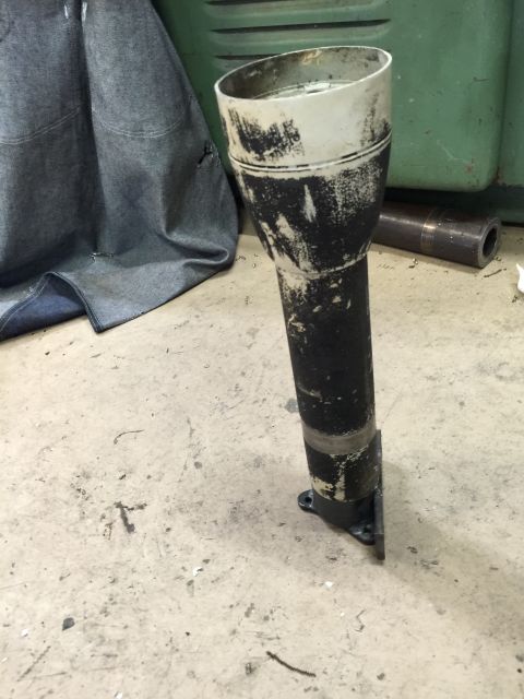 1965 Ford Mustang - A worn steering column shroud is shown, likely removed from a vehicle for repair or replacement.