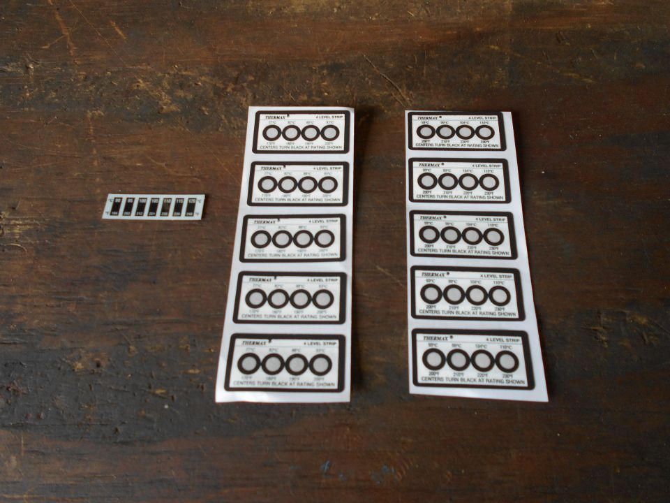 Sheet of gauge cluster decals with multiple circles and text, plus a separate strip of smaller decals