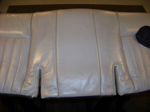 2001 Mercury Grand Marquis - Close-up of car seat upholstery, showing perforated side panels and stitching detail.